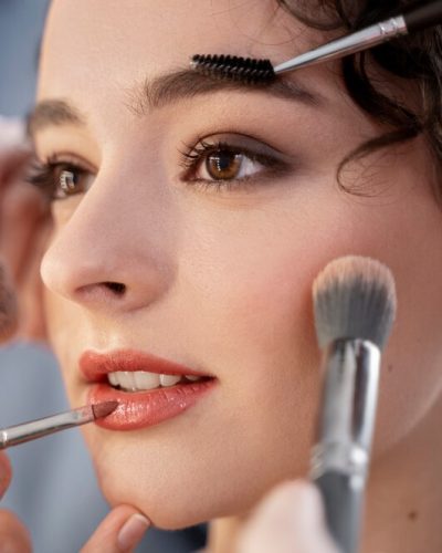 make-up-artist-getting-model-ready-photoshootin_23-2149305147